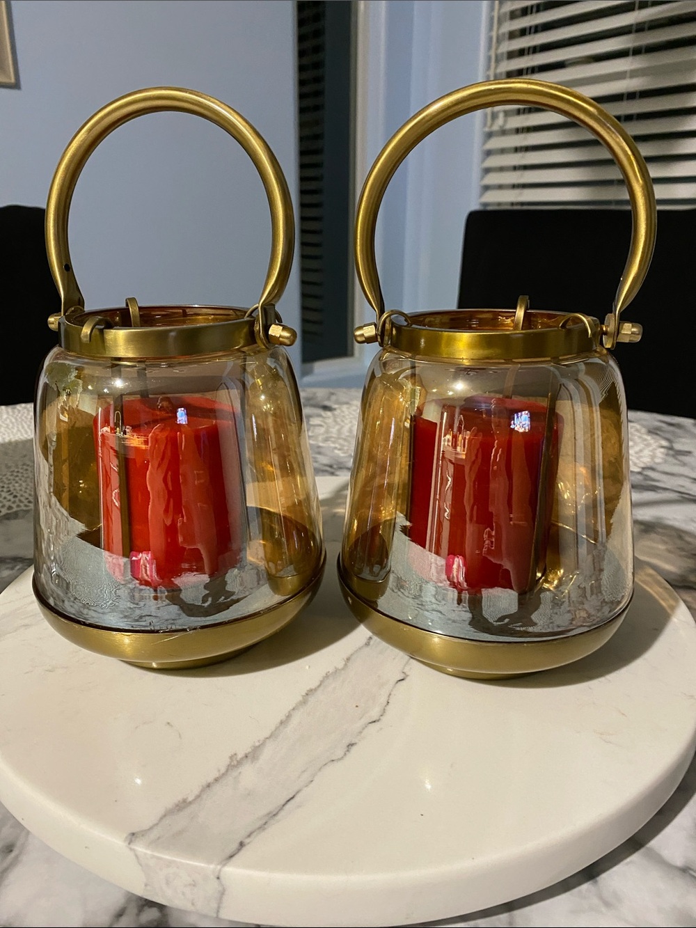 gold-tone glass and metal hurricane candle lanterns